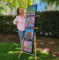 Australian artist Kerrie Grant with her native animal series of four original paintings on an easel